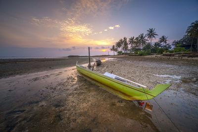 Scenic view of beach against sky during sunset