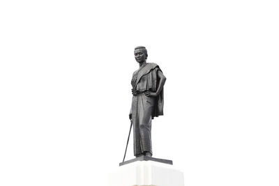 Low angle view of statue against white background