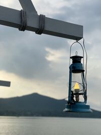 Coin-operated binoculars against sky