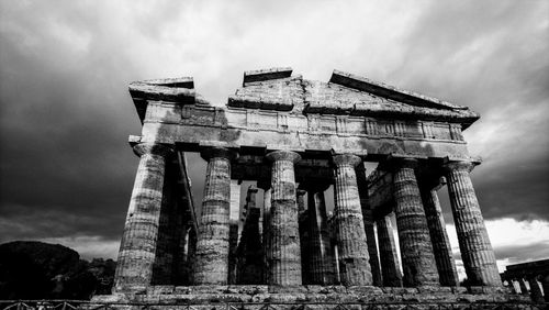 Low angle view of poseidon's temple in paestum black and white