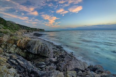 Scenic view of sea against sky during sunset