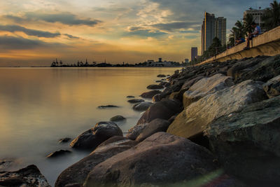 Scenic view of sea against sky at sunset