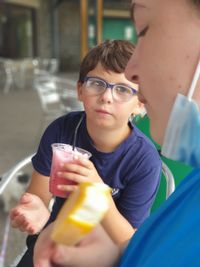 Portrait of boy drinking coffee