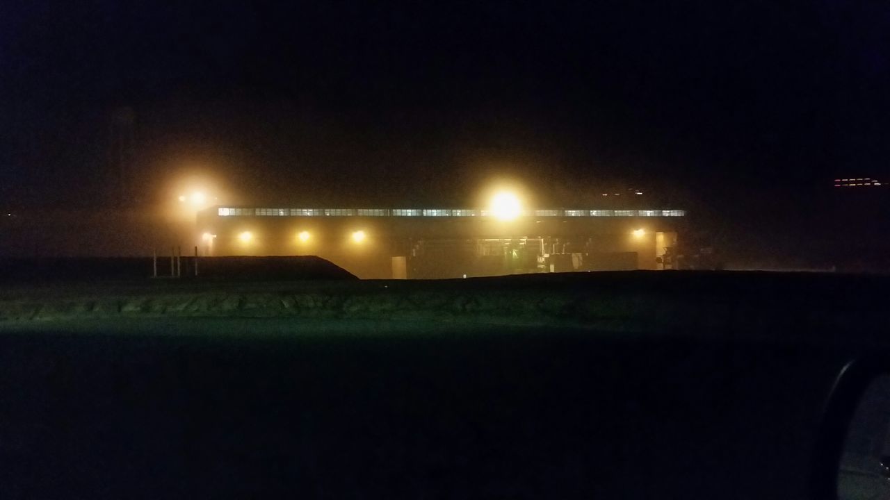 night, illuminated, copy space, transportation, dark, road, clear sky, lighting equipment, street light, street, mode of transport, no people, outdoors, land vehicle, light - natural phenomenon, sky, empty, field, built structure, light