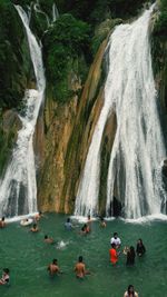 High angle view of people enjoying against waterfall