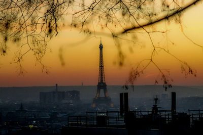 View of buildings in city during sunset