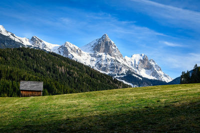 Scenic view of snowcapped mountains against sky