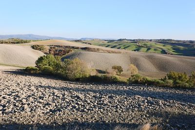 Scenic view of land against clear sky