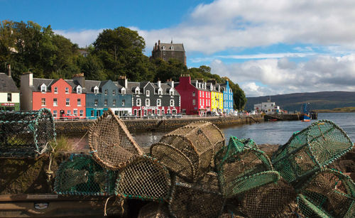 Scenic view of sea against buildings