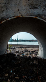 Close-up of sea seen through window