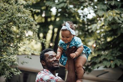 Full length of father with baby