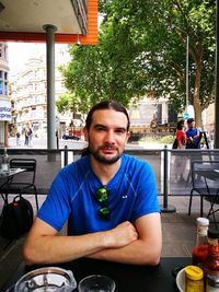 Portrait of man sitting outdoors