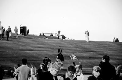 Group of people against clear sky