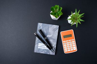 High angle view of information sign on table against black background