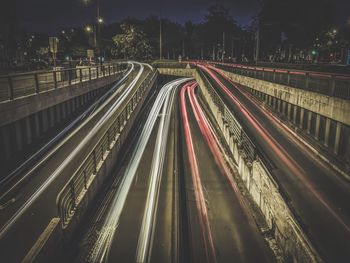 Light trails on road in city at night