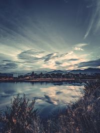 Scenic view of lake against sky during sunset