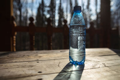 Close-up of glass bottle on table