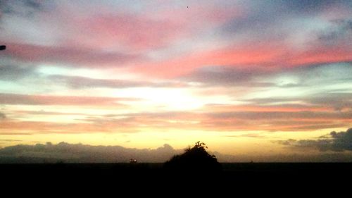 Scenic view of landscape at sunset