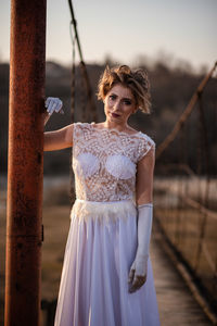 Portrait of woman standing outdoors