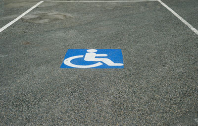 High angle view of disabled sign on road