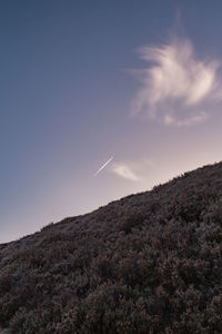 Low angle view of vapor trail against sky