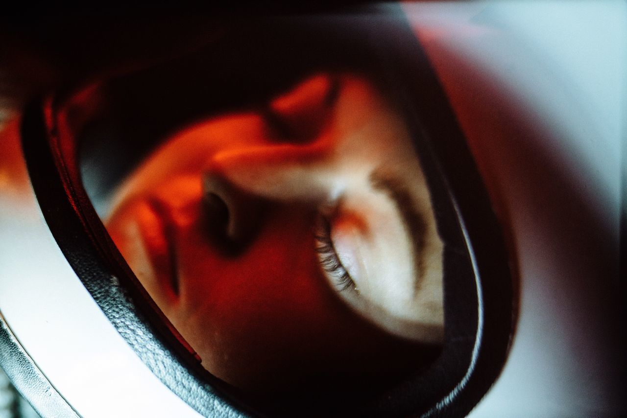 indoors, close-up, red, reflection, part of, no people, single object, glass - material, high angle view, still life, auto post production filter, detail, circle, transparent, window, black color, extreme close-up, studio shot, selective focus, shape