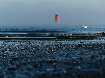 Scenic view of sea against clear sky during sunset