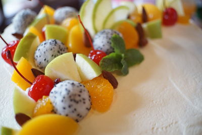 Close-up of chopped fruits in plate