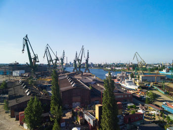 Panoramic view of commercial dock against clear sky