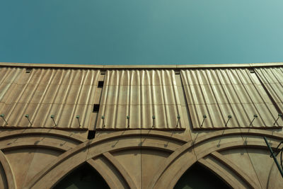 Low angle view of building against clear blue sky