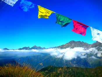 Low angle view of flags against sky