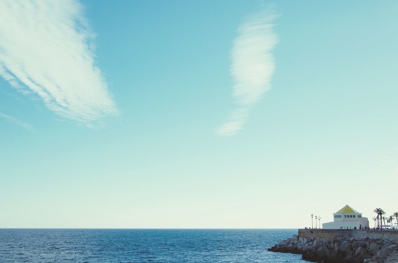 sea, horizon over water, water, sky, scenics, tranquil scene, tranquility, blue, beach, beauty in nature, built structure, nature, copy space, waterfront, idyllic, architecture, seascape, shore, day, calm