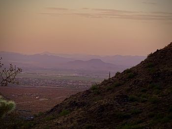 Scenic view of landscape against sky during sunset