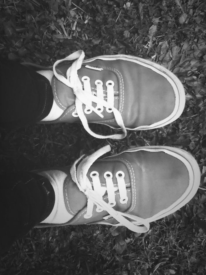 shoe, low section, person, footwear, pair, personal perspective, canvas shoe, close-up, high angle view, part of, jeans, field, shoelace, grass, human foot, lifestyles, communication