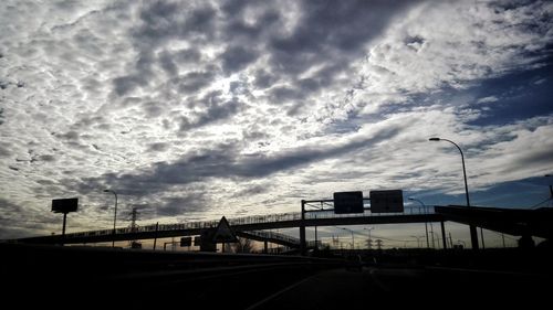 Road against cloudy sky