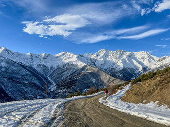 Scenic view of snowcapped mountains against sky