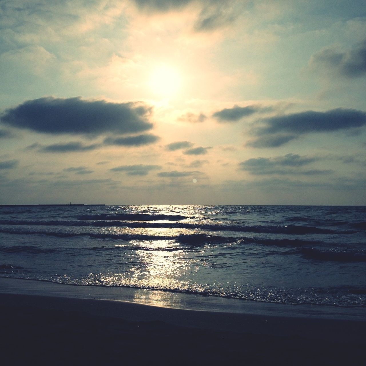 sea, horizon over water, beach, water, sky, scenics, shore, tranquil scene, beauty in nature, tranquility, cloud - sky, sand, nature, sun, wave, idyllic, sunset, cloud, sunlight, coastline