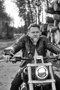 Man riding motorcycle on road