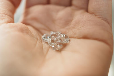 Close-up of person hand holding ring