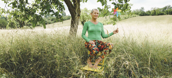 Full length of woman standing on field