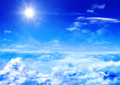 Low angle view of clouds against blue sky on sunny day