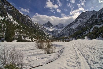 Scenic view of snowcapped mountains against sky