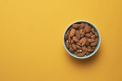 High angle view of food in bowl on yellow background