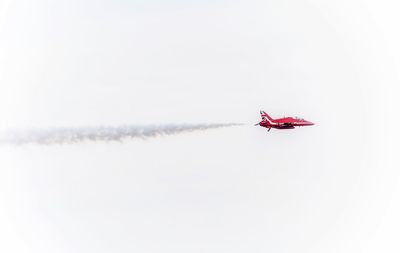 Airplane flying against sky