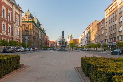 Street amidst buildings against sky in city