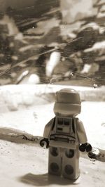 Close-up of toy on snow covered land