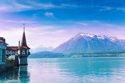 Scenic view of snowcapped mountains against blue sky