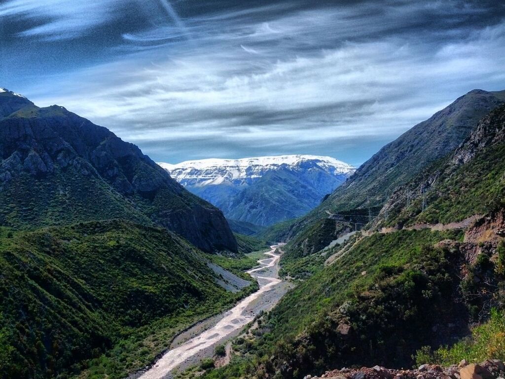 mountain, mountain range, scenics, tranquil scene, tranquility, sky, beauty in nature, landscape, nature, cloud - sky, non-urban scene, valley, cloud, idyllic, cloudy, day, remote, physical geography, outdoors, rocky mountains