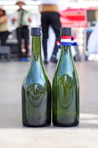 Close-up of wine bottles on table