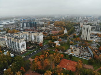 High angle view of buildings in city against sky